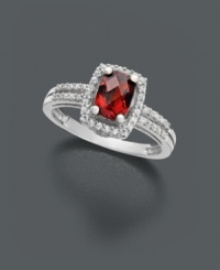 Cause a stir with this red hot number. A vivacious ring that features oval-cut garnet (1-1/10 ct. t.w.) with round-cut diamond (1/6 ct. t.w.) around the edges and in double rows at the band. Ring crafted in 14k white gold. Cause a stir with this red hot number. A vivacious ring that features oval-cut garnet (1-1/10 ct. t.w.) with round-cut diamond (1/6 ct. t.w.) around the edges and in double rows at the band. Ring crafted in 14k white gold.