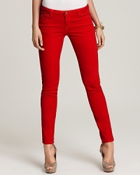 Gleaming silver signature accents enhance the dark hue of these MICHAEL Michael Kors jeans, cut in a slim silhouette for modern edge. Gleaming silver signature accents enhance the dark hue of these MICHAEL Michael Kors jeans, cut in a slim silhouette for modern edge.