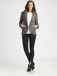 This tweed equestrian jacket with a collar lined with faux-fur and leather details has the makings of a sartorial showstopper. This tweed equestrian jacket with a collar lined with faux-fur and leather details has the makings of a sartorial showstopper.