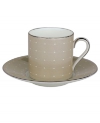 Enjoy a bold brew with this enormously stylish espresso cup and saucer set. From innovative designer Monique Lhullier, it features a pearlescent soft tan border with glossy raised dots and a fine stitch-like pattern. Enjoy a bold brew with this enormously stylish espresso cup and saucer set. From innovative designer Monique Lhullier, it features a pearlescent soft tan border with glossy raised dots and a fine stitch-like pattern.