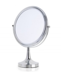 Don't miss a thing with this large-faced vanity mirror. A 360-degree revolving design offers both a regular and magnified view so you can perfect your look with ease. With a handsome chrome finish. Don't miss a thing with this large-faced vanity mirror. A 360-degree revolving design offers both a regular and magnified view so you can perfect your look with ease. With a handsome chrome finish.