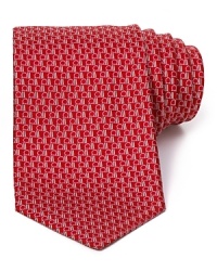 A handsome tie for discerning tastes, formed from lustrous silk and featuring an allover Gancini logo print from the always classic Salvatore Ferragamo. A handsome tie for discerning tastes, formed from lustrous silk and featuring an allover Gancini logo print from the always classic Salvatore Ferragamo.