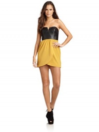 THE LOOKFaux leather structured bodiceSweetheart necklineContrasting colorblock mock wrap skirtBack zip with hook-and-eye closureTHE FITAbout 25 from top to hemTHE MATERIALUpper: PVCBottom: polyesterCARE & ORIGINHand washImportedModel shown is 5'9 (175cm) wearing US size Small.This item was originally available for purchase at Saks Fifth Avenue OFF 5TH stores. THE LOOKFaux leather structured bodiceSweetheart necklineContrasting colorblock mock wrap skirtBack zip with hook-and-eye closureTHE FITAbout 25 from top to hemTHE MATERIALUpper: PVCBottom: polyesterCARE & ORIGINHand washImportedModel shown is 5'9 (175cm) wearing US size Small.This item was originally available for purchase at Saks Fifth Avenue OFF 5TH stores.