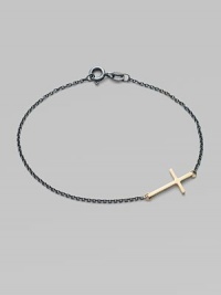 A gleaming 14k gold cross on an oxidized sterling silver chain.14k yellow gold Oxidized sterling silver Length, about 7 Pendant length, about ¾ Spring ring clasp Made in USA A gleaming 14k gold cross on an oxidized sterling silver chain.14k yellow gold Oxidized sterling silver Length, about 7 Pendant length, about ¾ Spring ring clasp Made in USA