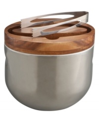 Clever design and modern materials fill the Mikko ice bucket with smart sophistication. Handsome acacia wood tops off polished stainless steel with sculpted handles for easy entertaining. Matching tongs fit neatly inside the lid. Designed by Neil Cohen for Nambe. Clever design and modern materials fill the Mikko ice bucket with smart sophistication. Handsome acacia wood tops off polished stainless steel with sculpted handles for easy entertaining. Matching tongs fit neatly inside the lid. Designed by Neil Cohen for Nambe.