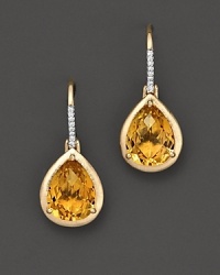 A beautiful faceted teardrop citrine earring in 14 Kt. yellow gold with diamond accents. A beautiful faceted teardrop citrine earring in 14 Kt. yellow gold with diamond accents.