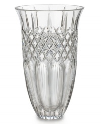 Narrow flutes and a diamond grid converge in pristine Waterford crystal, gracing the Shelton vase with old-world resplendency. A beautiful host for fresh flowers in your own home – or a memorable gift for someone you love. Shown center. Narrow flutes and a diamond grid converge in pristine Waterford crystal, gracing the Shelton vase with old-world resplendency. A beautiful host for fresh flowers in your own home – or a memorable gift for someone you love. Shown center.