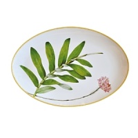 Adapted from botanical drawings of gardens in Mumbai, India, where an abundance of rare plant species grow, precisely detailed floral and vegetal illustrations adorn this fine porcelain platter from Bernardaud. It's edged with a rattan trompe l'oeil pattern reminiscent of popular Indian furniture designs. Adapted from botanical drawings of gardens in Mumbai, India, where an abundance of rare plant species grow, precisely detailed floral and vegetal illustrations adorn this fine porcelain platter from Bernardaud. It's edged with a rattan trompe l'oeil pattern reminiscent of popular Indian furniture designs.