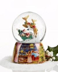 Up, up and away! This snow globe captures the magic of the season with Santa Claus taking flight through a light snow to start his Christmas deliveries. The base features a lovely painted scene of two children watching Santa and the reindeer fly through the night sky. Up, up and away! This snow globe captures the magic of the season with Santa Claus taking flight through a light snow to start his Christmas deliveries. The base features a lovely painted scene of two children watching Santa and the reindeer fly through the night sky.