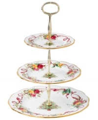 Royal Albert offers a festive twist on a favorite pattern, mixing Christmas trees, holly and bows with pink and gold blooms on the Old Country Roses Holiday tiered cake plate. Gold-banded porcelain coordinates flawlessly with the original dinnerware collection. Royal Albert offers a festive twist on a favorite pattern, mixing Christmas trees, holly and bows with pink and gold blooms on the Old Country Roses Holiday tiered cake plate. Gold-banded porcelain coordinates flawlessly with the original dinnerware collection.