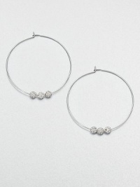 From the Brilliance Collection. A slender wire hoop, adorned with three sparkling beads, creates a look of understated glamour.GlassSilvertoneDiameter, about 1.25PiercedImported