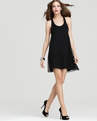 A sporty racerback and an edgy high-low hem infuse this Alice + Olivia dress with downtown-ready style. Go glam with sky-high platforms and a silver bangle. A sporty racerback and an edgy high-low hem infuse this Alice + Olivia dress with downtown-ready style. Go glam with sky-high platforms and a silver bangle.