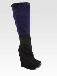 Shearling trim tops this tall silhouette of paneled suede, resting on a hidden wedge heel. Self-covered wedge, 5½ (140mm)Hidden platform, 1¾ (45mm)Compares to a 3¾ heel (95mm)Shaft, 17¼Leg circumference, 15¼Suede upper with shearling trimPull-on styleLeather liningRubber trek solePadded insoleMade in ItalyOUR FIT MODEL RECOMMENDS ordering one size up as this style runs small. Shearling trim tops this tall silhouette of paneled suede, resting on a hidden wedge heel. Self-covered wedge, 5½ (140mm)Hidden platform, 1¾ (45mm)Compares to a 3¾ heel (95mm)Shaft, 17¼Leg circumference, 15¼Suede upper with shearling trimPull-on styleLeather liningRubber trek solePadded insoleMade in ItalyOUR FIT MODEL RECOMMENDS ordering one size up as this style runs small.