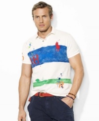 Light paint splatters and surplus-inspired graphics lend a rugged quality to a color-blocked polo shirt, crafted for a trim, modern fit from breathable cotton mesh. Light paint splatters and surplus-inspired graphics lend a rugged quality to a color-blocked polo shirt, crafted for a trim, modern fit from breathable cotton mesh.