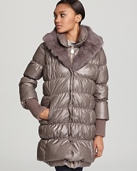 This three-in-one Elie Tahari coat and vest combo style is the season's must-have. Wear it everywhere, anywhere, any way-but wear it and flaunt chic quilting and decadent fur as winter weather intended. This three-in-one Elie Tahari coat and vest combo style is the season's must-have. Wear it everywhere, anywhere, any way-but wear it and flaunt chic quilting and decadent fur as winter weather intended.