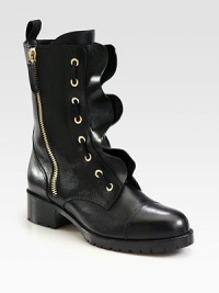 Channel your inner femme-fatale with this laced leather silhouette, combining ruffled edges and exposed goldtone zippers. Stacked heel, 2 (50mm)Stacked platform, ¾ (20mm)Shaft, 7½Leg circumference, 10½Leather upperSide zip and back pull-tabLeather liningRubber trek solePadded insoleMade in Italy Channel your inner femme-fatale with this laced leather silhouette, combining ruffled edges and exposed goldtone zippers. Stacked heel, 2 (50mm)Stacked platform, ¾ (20mm)Shaft, 7½Leg circumference, 10½Leather upperSide zip and back pull-tabLeather liningRubber trek solePadded insoleMade in Italy