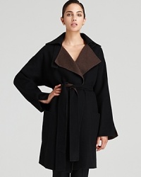 Enjoy a luxurious silhouette in an oversized Halston Heritage coat, touting a contrast collar and tie belt for chic inspiration. Enjoy a luxurious silhouette in an oversized Halston Heritage coat, touting a contrast collar and tie belt for chic inspiration.
