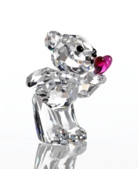 Romance is in the air with this Swarovski crystal Kris Bear. Puckering up to a perfect fuchsia heart, he's sure to win over your special valentine. Romance is in the air with this Swarovski crystal Kris Bear. Puckering up to a perfect fuchsia heart, he's sure to win over your special valentine.