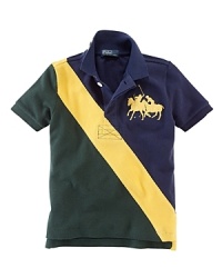 A pieced banner stripe and embroidered Dual Match pony add sporting heritage touches to the classic cotton mesh polo. A pieced banner stripe and embroidered Dual Match pony add sporting heritage touches to the classic cotton mesh polo.