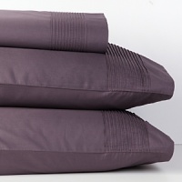 Pure cotton sateen with pleated detail on flat sheet, pillowcase and bedskirt. Pure cotton sateen with pleated detail on flat sheet, pillowcase and bedskirt.