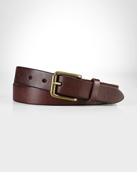 A slim leather belt is embellished with an antiqued brass buckle for a classic, timeworn aesthetic. A slim leather belt is embellished with an antiqued brass buckle for a classic, timeworn aesthetic.