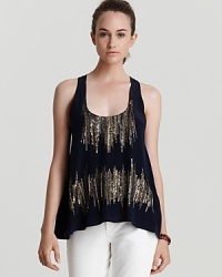 This glamorous Creative Commune tank boasts gold and silver beads for evening glamour, plus a sporty racerback--proving 24-hour style is the look of the moment and with skinny jeans you've mastered the theme. This glamorous Creative Commune tank boasts gold and silver beads for evening glamour, plus a sporty racerback--proving 24-hour style is the look of the moment and with skinny jeans you've mastered the theme.