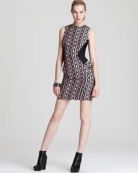Rock downtown cool in this Milly mini dress, boasting a bold zigzag print juxtaposed against solid side panels with ruffle peplums. An exposed back zipper continues the edgy look, perfectly punctuated with wedge booties and an armful of metallic bangles. Rock downtown cool in this Milly mini dress, boasting a bold zigzag print juxtaposed against solid side panels with ruffle peplums. An exposed back zipper continues the edgy look, perfectly punctuated with wedge booties and an armful of metallic bangles.