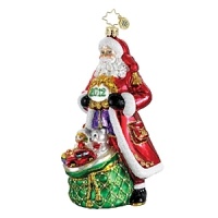 A red-robed Santa toting a bag of toys celebrates the season. A red-robed Santa toting a bag of toys celebrates the season.