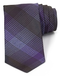 Luxurious, tonally plaid silk is cut in a skinny-tie silhouette for a dose of modern refinement. Luxurious, tonally plaid silk is cut in a skinny-tie silhouette for a dose of modern refinement.