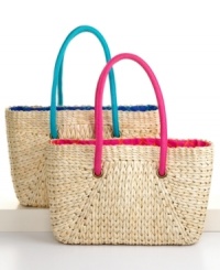 Carry all your provisions for a day at the beach in a stylish tote woven of natural rush. Vibrant poplin lining adds a splash of summer color and gives the classic style of the bag a fresh, modern accent. Carry all your provisions for a day at the beach in a stylish tote woven of natural rush. Vibrant poplin lining adds a splash of summer color and gives the classic style of the bag a fresh, modern accent.