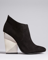 Put your pedal to the metal in these Dolce Vita Booties featuring architecturally inspired metallic heels. Beyond basic, they will wear well with all your modern, minimalist favorites. Put your pedal to the metal in these Dolce Vita Booties featuring architecturally inspired metallic heels. Beyond basic, they will wear well with all your modern, minimalist favorites.