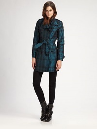 A chic tonal plaid patterns this classic trench design.Foldover collarGunflapDouble-breasted button frontSelf beltButton pocketsBelted cuffsButton rainflapAbout 30 from shoulder to hemPolyesterDry cleanImportedModel shown is 5'10 (177cm) wearing US size 4. A chic tonal plaid patterns this classic trench design.Foldover collarGunflapDouble-breasted button frontSelf beltButton pocketsBelted cuffsButton rainflapAbout 30 from shoulder to hemPolyesterDry cleanImportedModel shown is 5'10 (177cm) wearing US size 4.