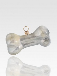 Celebrate everyone's best friend with this shimmering bone-shaped ornament, delicately crafted of mouth-blown, hand-painted glass, in honor of precious pooches everywhere.Glass3.5L X 1.5H X 1.5DImported Celebrate everyone's best friend with this shimmering bone-shaped ornament, delicately crafted of mouth-blown, hand-painted glass, in honor of precious pooches everywhere.Glass3.5L X 1.5H X 1.5DImported