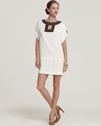 Contrast edging lends a graphic punch to this Milly dress, cut in a flattering, airy silhouette. Contrast edging lends a graphic punch to this Milly dress, cut in a flattering, airy silhouette.
