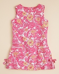 A sunny look from Lilly Pulitzer, this classic shift dress is rendered in bold florals, with bow accents at the side and front pockets with ric rac trim. A sunny look from Lilly Pulitzer, this classic shift dress is rendered in bold florals, with bow accents at the side and front pockets with ric rac trim.