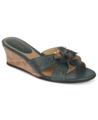 Crisp perforated cut outs and a leathery bow on the toe make the Zing wedge sandals by Life Stride the perfect summer essential. Crisp perforated cut outs and a leathery bow on the toe make the Zing wedge sandals by Life Stride the perfect summer essential.