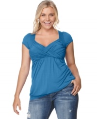 Soprano upgrades the cap sleeved plus size top with an enhancing crisscross front and slimming empire waist. Soprano upgrades the cap sleeved plus size top with an enhancing crisscross front and slimming empire waist.