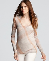 Burberry Brit's signature check print is splashed in refreshing peach on this cozy sweater from the experts on British cool. Burberry Brit's signature check print is splashed in refreshing peach on this cozy sweater from the experts on British cool.