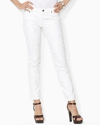 A chic skinny silhouette lends contemporary polish to a unique embroidered denim jean, rendered with a hint of stretch for a flattering fit. A chic skinny silhouette lends contemporary polish to a unique embroidered denim jean, rendered with a hint of stretch for a flattering fit.