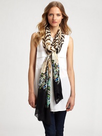 A dramatic zebra print is accented by colorful crystals on this posh silk wrap.SilkAbout 28 X 110Dry cleanMade in Italy A dramatic zebra print is accented by colorful crystals on this posh silk wrap.SilkAbout 28 X 110Dry cleanMade in Italy