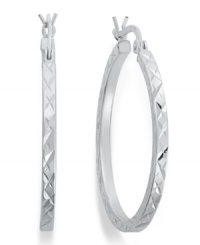 An intricate etched design reflects the light on Giani Bernini's luminous hoop earrings. Crafted in sterling silver. Approximate diameter: 1-1/4 inches.