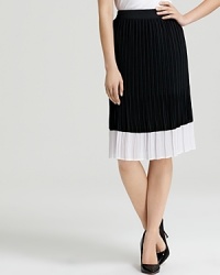 Sophisticated shades of black and white toughen a delicately pleated Bloomingdale's Exclusive BASLER skirt. Style with a utility shirt for modern femininity. Sophisticated shades of black and white toughen a delicately pleated Bloomingdale's Exclusive BASLER skirt. Style with a utility shirt for modern femininity.
