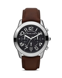 Borrow from the boys with this handsome leather-strapped watch from MICHAEL Michael Kors. It's bold dial and oversized face are the perfect foil for feminine looks. Borrow from the boys with this handsome leather-strapped watch from MICHAEL Michael Kors. It's bold dial and oversized face are the perfect foil for feminine looks.
