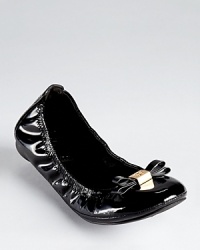 In a flexible silhouette, Tory Burch's slick Eddie flats are dressed up with a ladylike bow and iconic logo. In a flexible silhouette, Tory Burch's slick Eddie flats are dressed up with a ladylike bow and iconic logo.