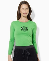 A long-sleeved cotton tee is given a luxurious update, finished with an embroidered and beaded crest at the front. A long-sleeved cotton tee is given a luxurious update, finished with an embroidered and beaded crest at the front.