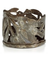 Cut, hammered and varnished by artist Michaelson, this metal candle holder accompanies flickering candlelight with intricate birds and branches. Steel from recycled barrels gives each one-of-a-kind piece a rustic beauty perfected by Haiti's esteemed artisans. Cut, hammered and varnished by artist Michaelson, this metal candle holder accompanies flickering candlelight with intricate birds and branches. Steel from recycled barrels gives each one-of-a-kind piece a rustic beauty perfected by Haiti's esteemed artisans.