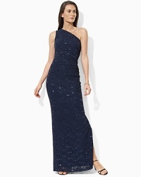 Glistening sequins and a romantic lace overlay lend timeless femininity to the exquisite gown, tailored in a floor-skimming one-shoulder silhouette for a glamorous look. Glistening sequins and a romantic lace overlay lend timeless femininity to the exquisite gown, tailored in a floor-skimming one-shoulder silhouette for a glamorous look.