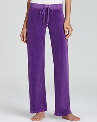 Rendered in plush terry, these Juicy Couture pants celebrate your relaxed style sensibility with an effortless wide-leg silhouette. Rendered in plush terry, these Juicy Couture pants celebrate your relaxed style sensibility with an effortless wide-leg silhouette.