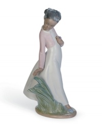 Stopping to smell and pick flowers, a beautiful young girl enjoys a breezy spring day in this delicately glazed figurine from Lladro. Stopping to smell and pick flowers, a beautiful young girl enjoys a breezy spring day in this delicately glazed figurine from Lladro.