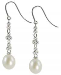 Sleek and sophisticated, this pair of sterling silver earrings dazzles with cultured freshwater pearls (9-9-1/2 mm) offset by rhodium-plated sparkle beads for a lustrous touch. Approximate drop: 1-7/8 inches. Sleek and sophisticated, this pair of sterling silver earrings dazzles with cultured freshwater pearls (9-9-1/2 mm) offset by rhodium-plated sparkle beads for a lustrous touch. Approximate drop: 1-7/8 inches.